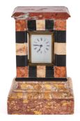 An Edwardian specimen marble carriage clock stand with brass carriage clock: the eight-day duration