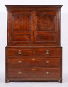 A George III oak housekeeper's cupboard, circa 1770 and later adapted,