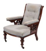 A Victorian mahogany and button upholstered library armchair, in Gothic taste, mid 19th century,
