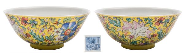 A fine Chinese yellow-ground famille rose bowl: the exterior enamelled with numerous blooms