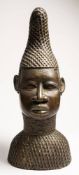 A 20th Century Benin bronze bust: wearing traditional curved and pointed headdress, 46cm high.