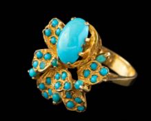 An Iranian turquoise ring,: the oval cabochon turquoise in a claw setting,