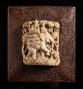 Indian carved ivory panel: of an elephant in a wood , the howdah containing a deity,
