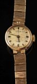 A 9ct gold rotary wristwatch:, the dial with baton markers to a textured fancy link bracelet,