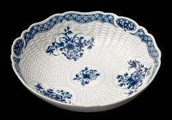 A First Period Worcester blue and white junket dish: with shaped rim,