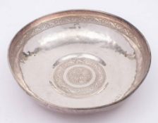 A Persian silver bowl: of beaten circular form,