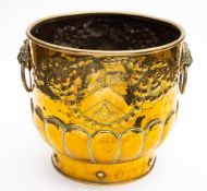 A Dutch log bin: of cylindrical outline with repousse decorated coat of arms,