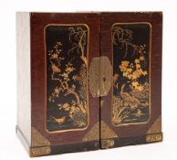 A Japanese lacquered Kodansu: the fold-open box with rectangular panels of exotic birds amongst