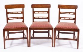 A set of four Regency mahogany and upholstered side chairs, early 19th century,