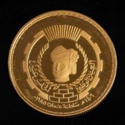 An Oman 22ct gold 15th National Day commemorative coin, 20g, in a case with paperwork.