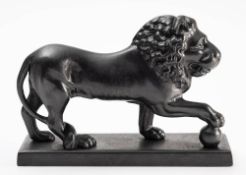 A cast iron door porter after the Medici Lion: by the Kendrick foundry, on a rectangular base,