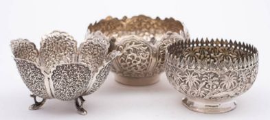 An Indian silver sugar basin: of circular form with embossed jungle scenes, 8cm diameter,