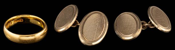 A 22 carat gold ring,: of plain polished form, stamped 22 with full Birmingham hallmarks,