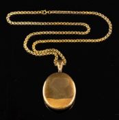 A locket pendant,: the oval locket pendant on a fancy link chain, stamped 9ct, locket 6.