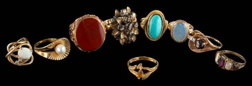 A group of eight gem set rings,