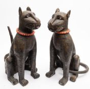 A large pair of Benin bronze leopards: seated on their haunches,
