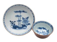A Chinese 'Nanking Cargo' Batavian teabowl and saucer: painted in cafe-au-lait and underglaze blue