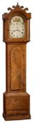 A George III mahogany longcase clock: the eight-day duration movement striking the hours on a bell