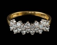 An 18 carat gold and diamond ring,: set with brilliant cut diamonds, approximately 0.