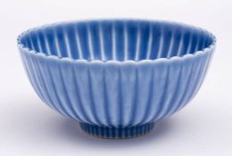A Chinese lavender blue-glazed 'chrysanthemum' bowl: six-character Yongzheng mark within double