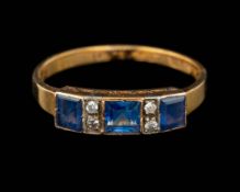 A sapphire and diamond ring,: set with three square cut sapphires with old cut diamonds in between,