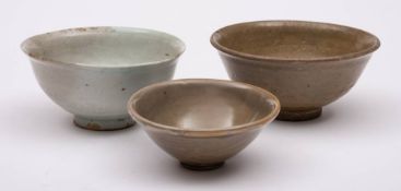 A group of three Chinese celadon glazed bowls,