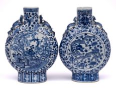 A matched pair of Chinese blue and white moonflasks: with chilong handles,