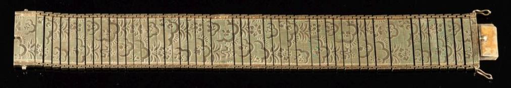 A gold coloured bracelet,: the rectangular panel links with foliate decoration,