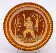 A Welsh [Claypits Pottery] dated slipware dish: decorated in white and brown slips under a lead