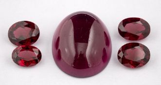 ! A group of loose garnets,: an oval cabochon garnet and three oval cut garnets, approximately 62.