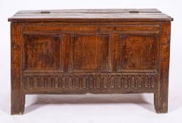 An oak coffer, later 17th century and later adapted,: with hinged top,
