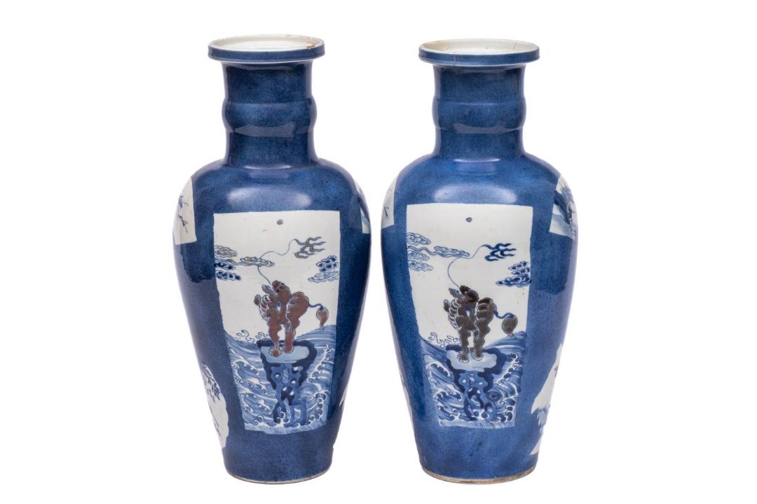 A pair of Chinese underglaze blue and copper-red rouleau vases: each of ovoid form with cylindrical