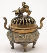 Two Chinese bronze censers: one of cylindrical form decorated in high relief with nine scholars,