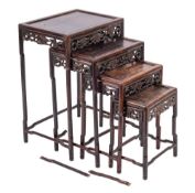 A nest of four Chinese carved and stained hardwood quartetto tables, late 19th / early 20th century,