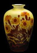 A Gallé cameo glass vase: of oviform the matt yellow body overlaid with amber and brown flowers and