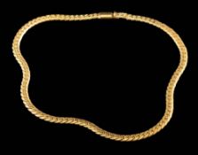 A gold coloured necklace:, the polished curb links to a concealed clasp, stamped 750, 38cm long,