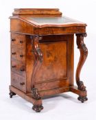A Victorian walnut Davenport, circa 1870,
