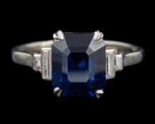 An Art Deco sapphire and diamond ring,: the rectangular cut sapphire, ca 3.