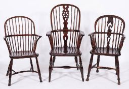Three elm, oak and ash Windsor elbow chairs, 19th century,