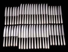 A set of twenty four Elizabeth II silver handled table knives, maker Terry Shaverin, Sheffield,