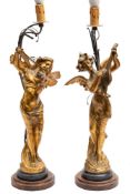 A pair of Victorian style gilt spelter figural lamps: modelled as angels playing musical