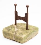 A Victorian cast iron boot scraper: the three blades set between swan and urn decorated arched