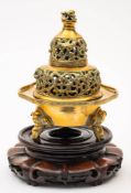 A Chinese bronze censer: of circular form raised on three elephant head supports beneath a