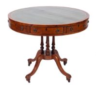 A Victorian yew wood and leather inset library drum table, mid 19th century,