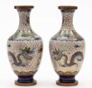 A pair of early 20th century Chinese cloisonne vases: of baluster form decorated with dragons