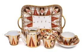 An early 19th century English breakfast set: painted with blue and orange flowers and gilt foliage
