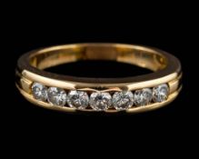 A diamond half eternity ring,: set with seven brilliant cut diamonds, approximately 0.