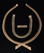 A 1960s 9 carat gold necklace, bracelet and ring by Roy King,