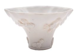 A Chinese blanc-de-Chine seal-paste box and cover and a similar libation cup,