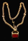 A foil backed quartz set fob,: with chased foliate decoration, on a fancy link chain, fob 2.